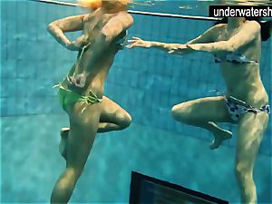 two spectacular amateurs displaying their bodies off under water